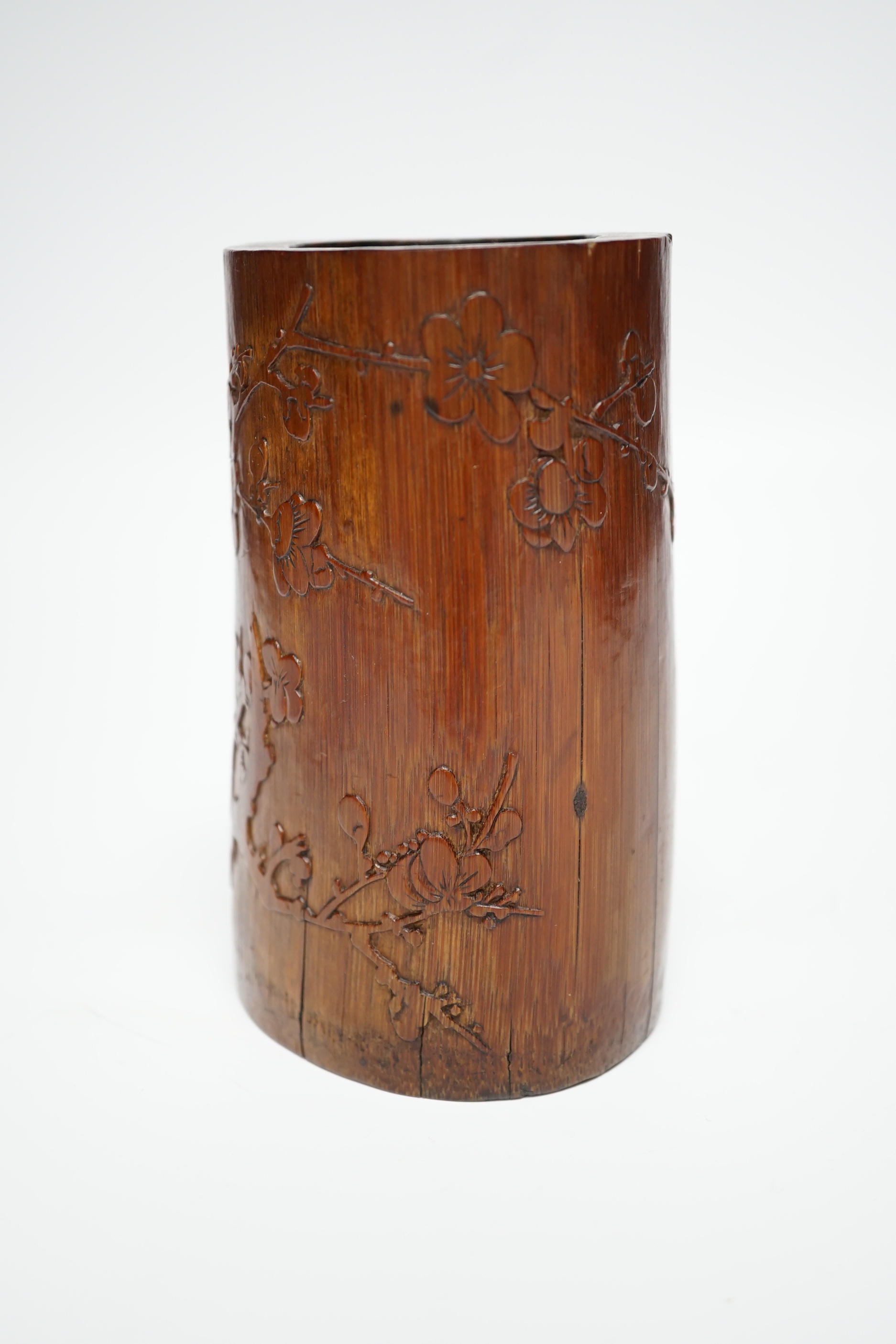 A 19th century Chinese Daoist bamboo brushpot, inscribed with a poem, 13cm high